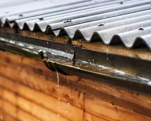 rain-flows-down-from-roof-min